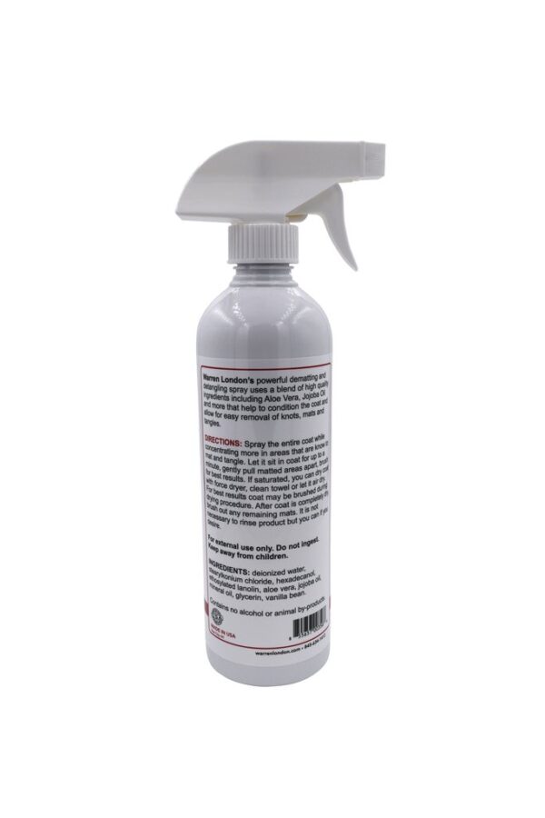 A bottle of spray cleaner with a white cap.