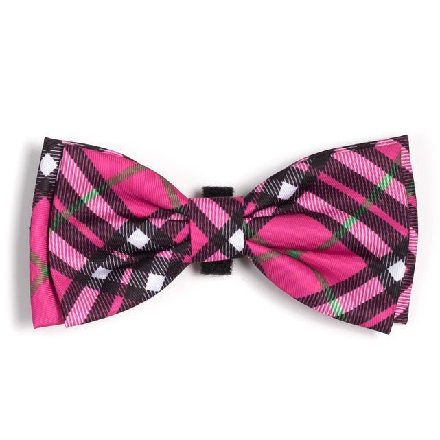 A pink bow tie with black and white plaid pattern.