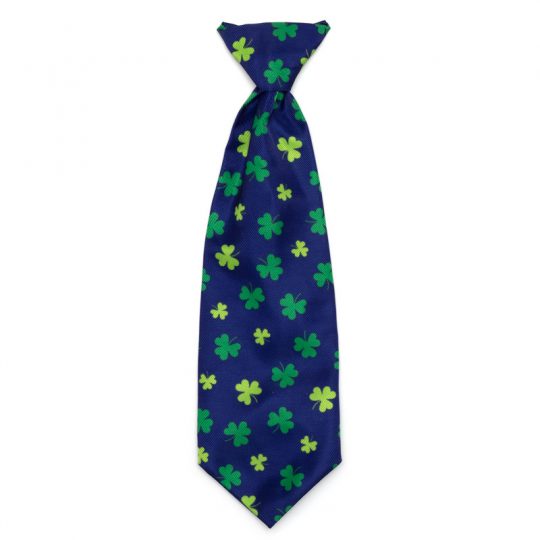 A blue tie with green and yellow clovers on it.
