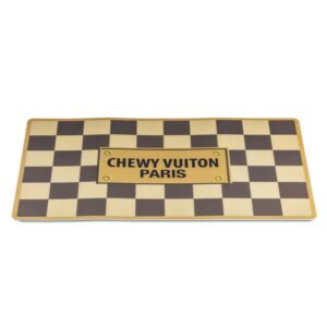 A checkered floor mat with the words chewy vuitton paris on it.
