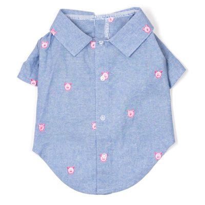 A blue shirt with pink smiley faces on it.