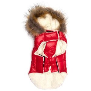 A red and white coat with fur on top of it.