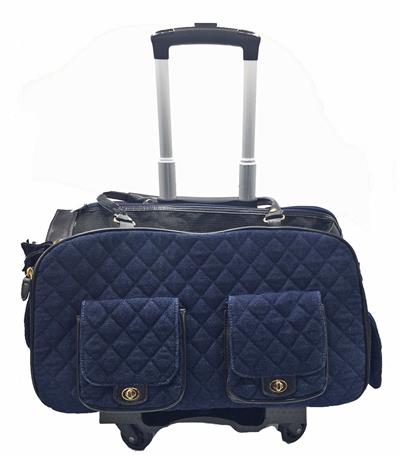 A blue quilted bag on wheels with two pockets.