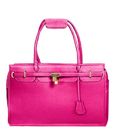 A pink purse is shown with the handle down.