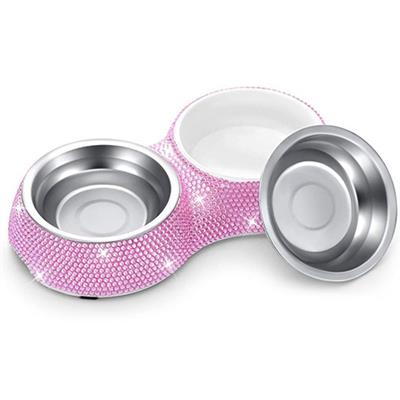A pink bowl with a white base and silver rim.