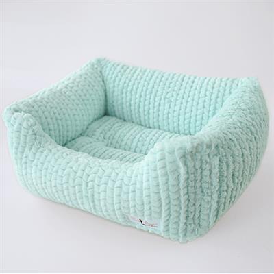 A small dog bed made of knitted fabric.