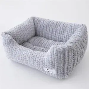 Knitted white dog bed