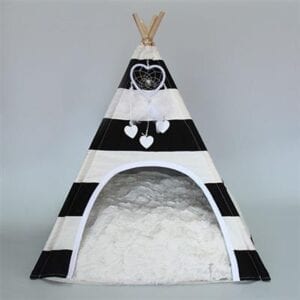 A black and white tipi with a heart on the top.