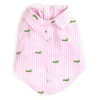 A pink striped shirt with green and white alligator print.