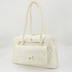A white purse with a gold chain handle.