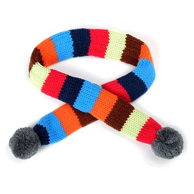A colorful striped scarf with pom poms on it.