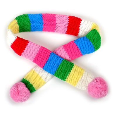 A colorful striped scarf with pom poms on it.