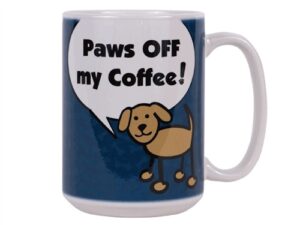 A coffee mug with a dog saying paws off my coffee.