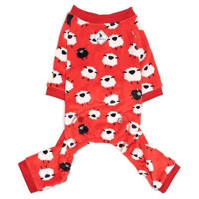 A red and white sheep pajamas is on the ground.