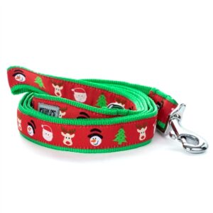 A dog leash with christmas themed fabric.