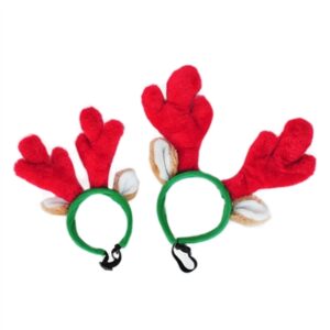 A pair of red antlers with shells on them.