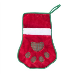 A red and white christmas stocking with a paw print on it.