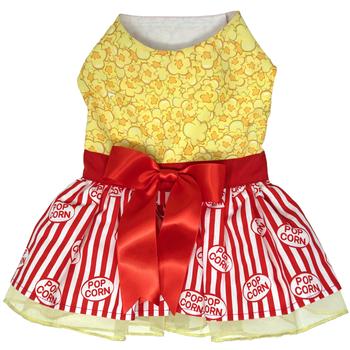 A dress with popcorn on it and red ribbon.