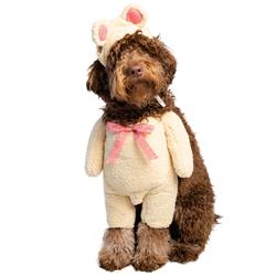 A dog wearing bunny ears and pajamas.