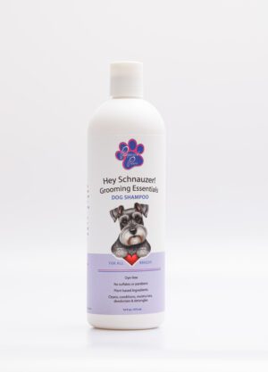 A bottle of dog grooming shampoo sitting on top of a table.